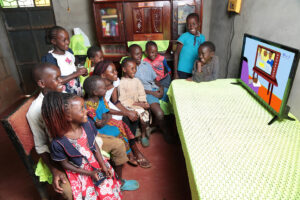 Children from a rural home in Ukambani, Kenya, able to continue education thanks to off-grid solar television.