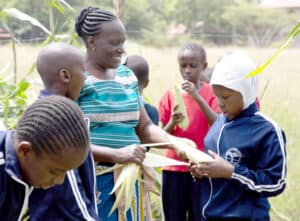 Steiner School Mbagathi: Gardening teacher Rose M Ingala with pupils