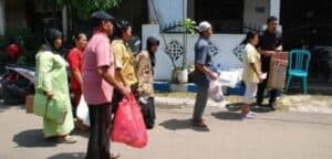 Queue of citizens in Indonesia who can trade their garbage for medicine and medical services