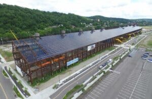 Last of 4,784 silicon solar panels being installed on roof of Mill 19 at Pittsburgh’s Hazelwood Green