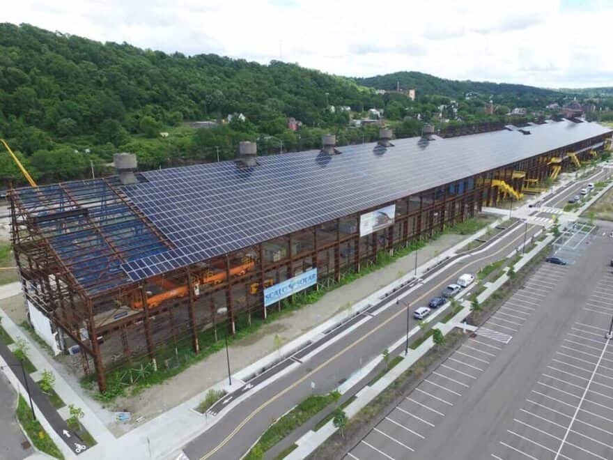 Last of 4,784 silicon solar panels being installed on roof of Mill 19 at Pittsburgh’s Hazelwood Green