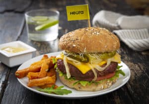 Heura burger on a plate with fries