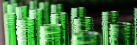 Close-up image of green glass bottles