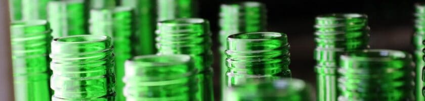 Close-up image of green glass bottles