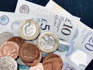 Notes and coins signifying profit for UK construction