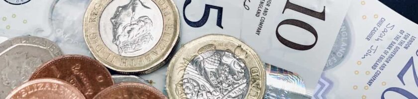 Notes and coins signifying profit for UK construction