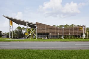 Side elevation showing Kebony louvred exterior of McDonald’s Flagship-Disney restaurant, in Orlando