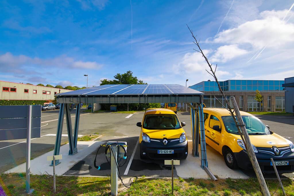 La Poste delivery vehicles at solar charging tests station for 'Buildings as a Grid' concept created by Eaton