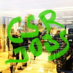 Workers in London city office pictured with 'CSR Jobs' daubed over image in green.