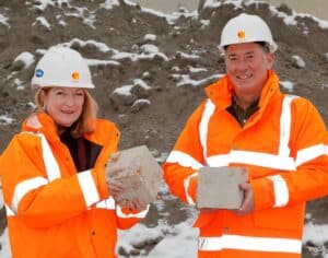 Jill Farrell, Director, Customer Engagement and Communications, at Zero Waste Scotland and Innovative Ash Solutions Director Robert Green, holding test blocks made from their innovative end-of-waste product.