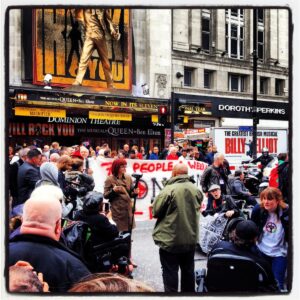 Crowd of protesters with banners in London.