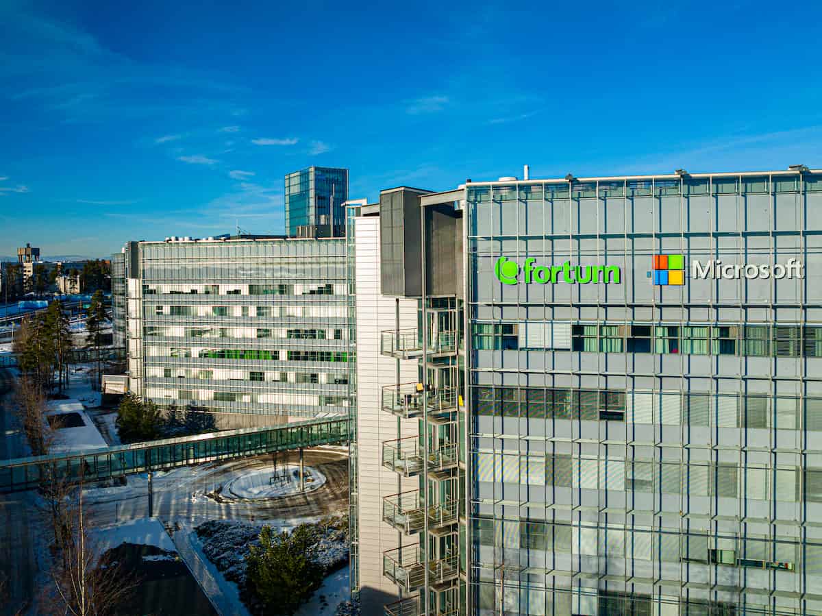 Multi-storey commercial building exterior, showing both Fortum and Microsoft logos.