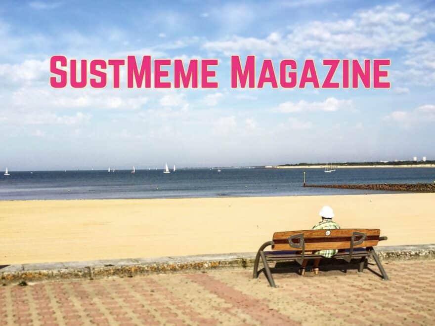Image of person in sun hat seen from behind, seated on bench and looking out to sea, with SustMeme Magazine text overlaid in pink.