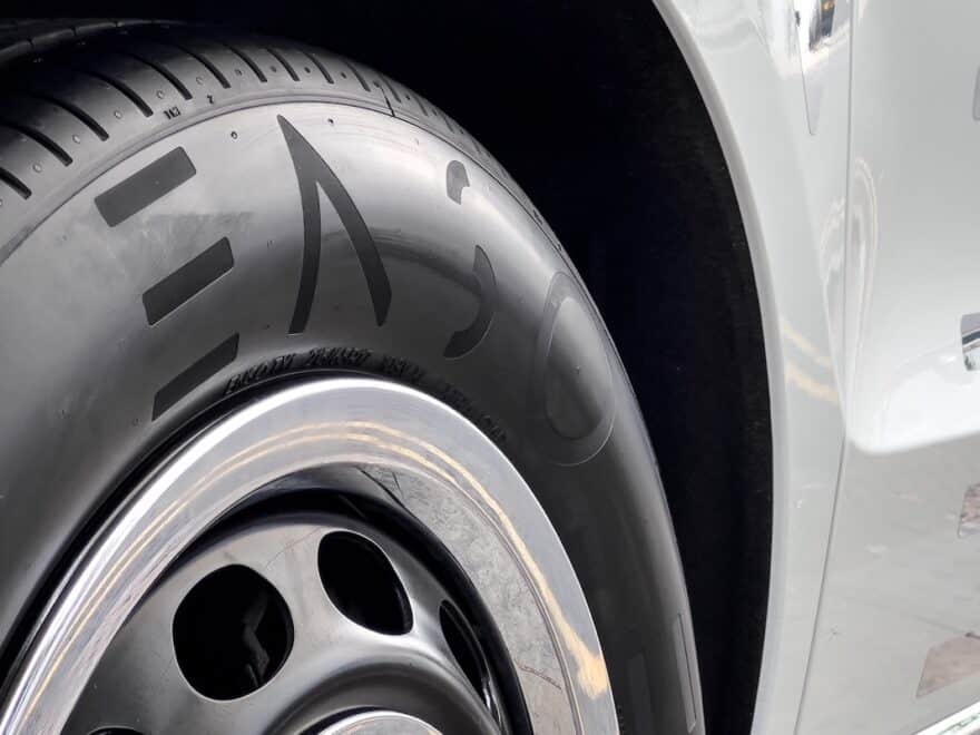 Close-up of ENSO tyre on car wheel.
