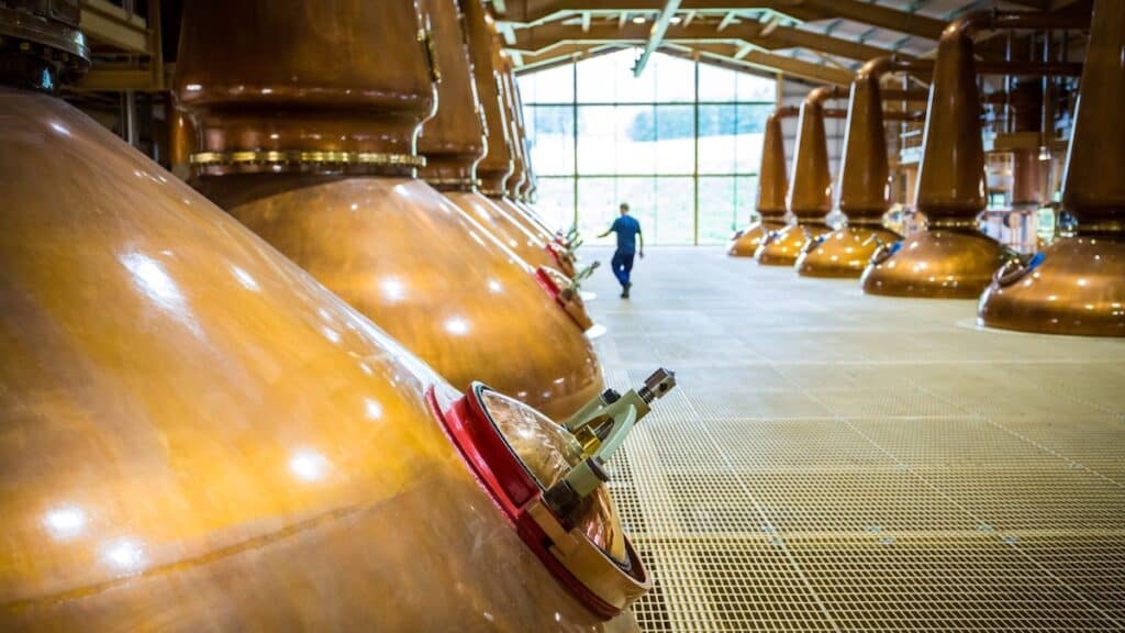 Interior of The Glenlivet distillery, in Speyside, Scotland, showing lantern-shaped copper stills.