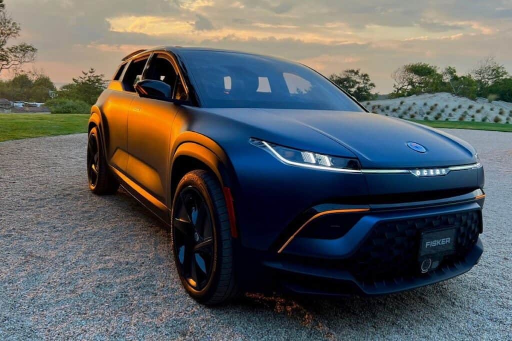 New Fisher Ocean SUV, pictured from front in dark blue, at sunset.