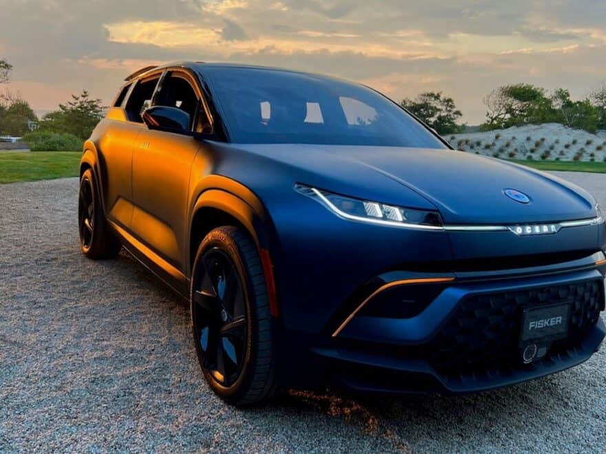 New Fisher Ocean SUV, pictured from front in dark blue, at sunset.