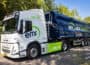 Volvo FM all-electric truck in white and blue livery, with EMR Metal Recycling branding down side, pictured on country road.