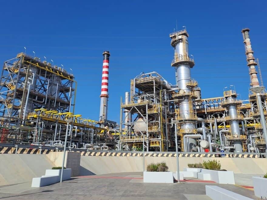 Industrial facility shot against blue sky shows Cepsa Química's Puente Mayorga plant, in Cádiz, Spain.