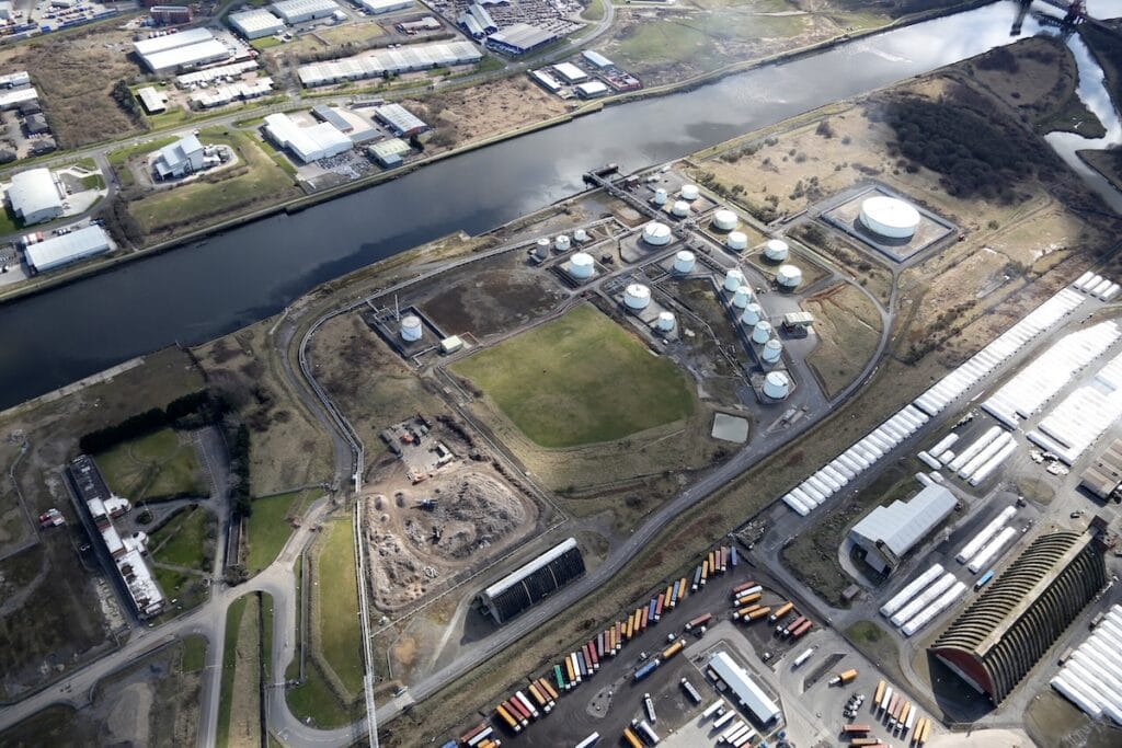 Aerial view of Riverside site, showing existing industrial facilities and planned development area.