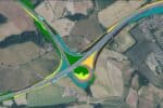 Aerial view of major road intersection in rural location, with bright yellow, green and blue highlights beside highways to show new data overlay.