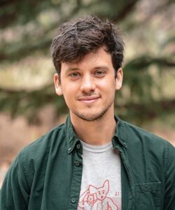 Portrait of Marshall Moutenot, Chief Executive Officer of Upstream Tech, shot outdoors in open green casual shirt, with grey top beneath.