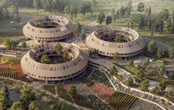 Visualisation of Almanakken project by Sweco Architects shows three ring-shaped building structures set within a regenerative green neighbourhood.