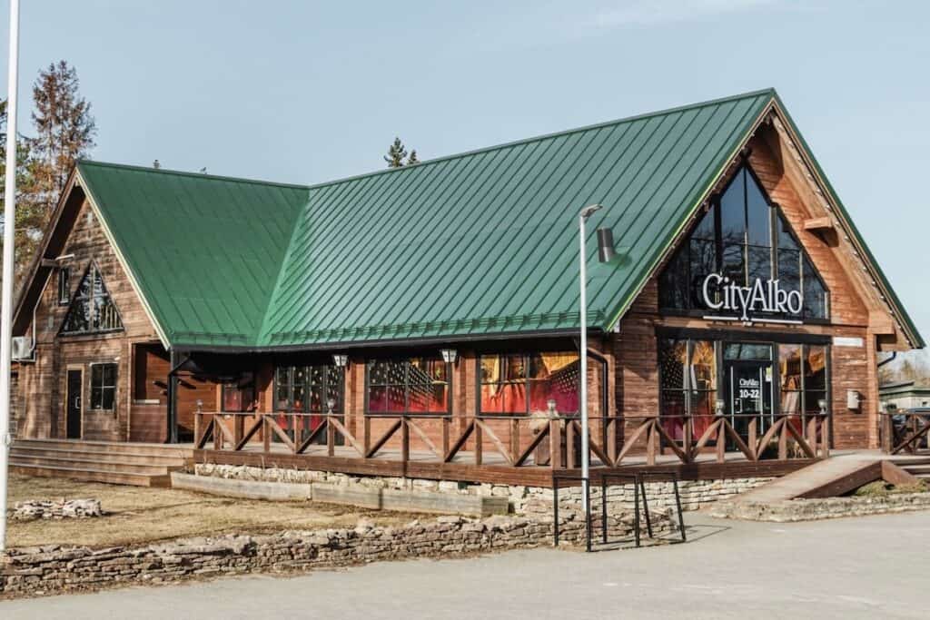 Mock-up of timber CityAlko store with solar roof in Pale Green to match colour palette of weathered copper on historic buildings.