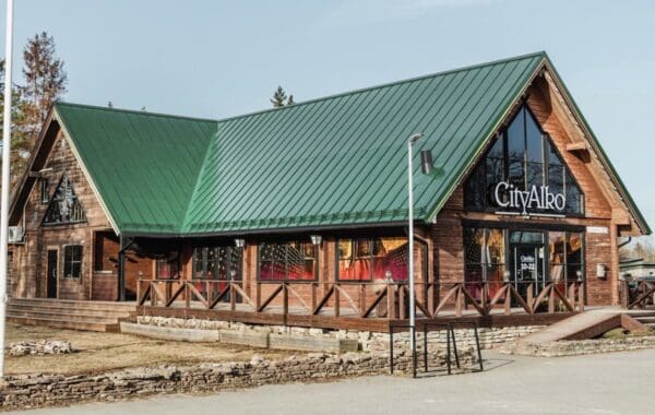 Mock-up of timber CityAlko store with solar roof in Pale Green to match colour palette of weathered copper on historic buildings.