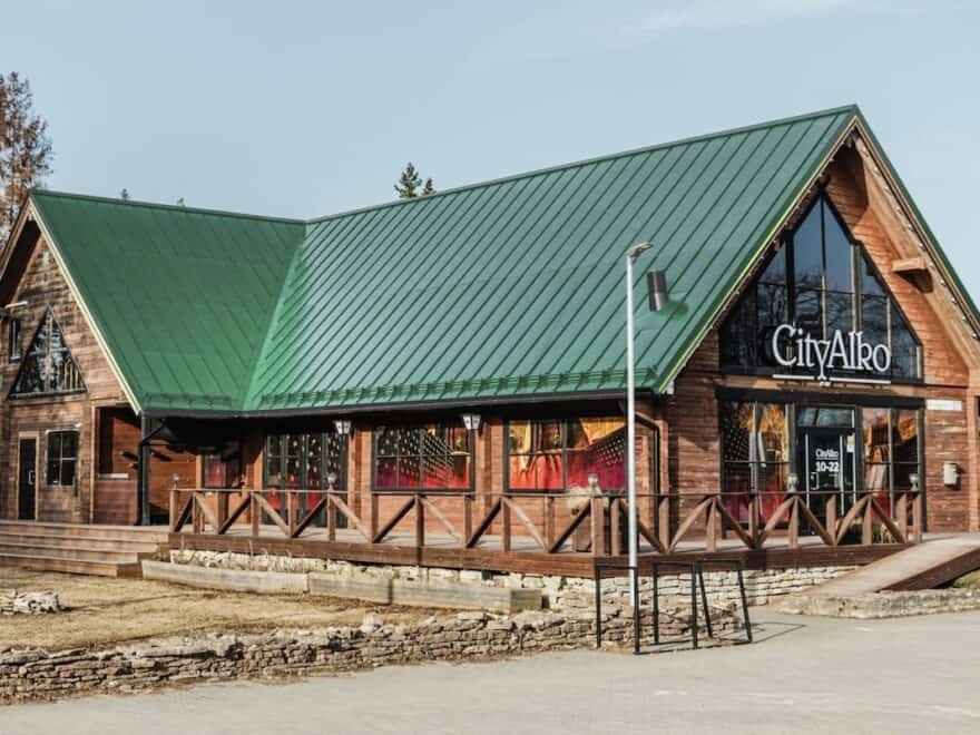 Mock-up of timber CityAlko store with solar roof in Pale Green to match colour palette of weathered copper on historic buildings.