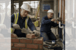 Square ChatGPT of construction site, ageing workers in hard hats; bricklayer in high-vis (L) and plumber in boiler suit (R); faded duplicate 25% panels L & R.